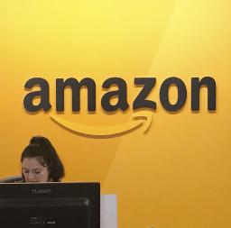 　アマゾン・コムのロゴマーク（共同）